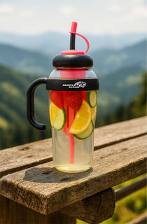 Hydration bottle with fruit infuser on a wooden surface with a mountainous background