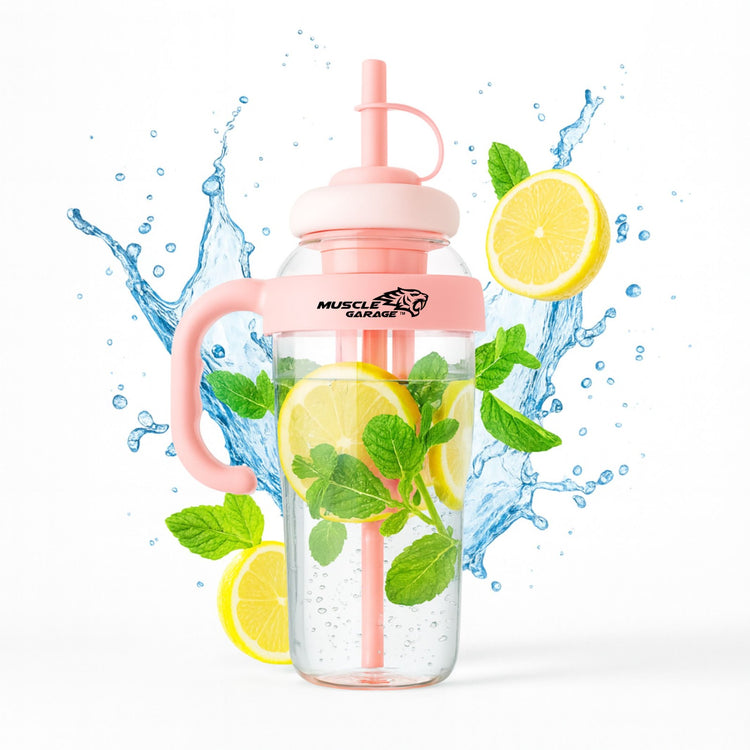 Pink water bottle with lemon slices and mint leaves on a white background